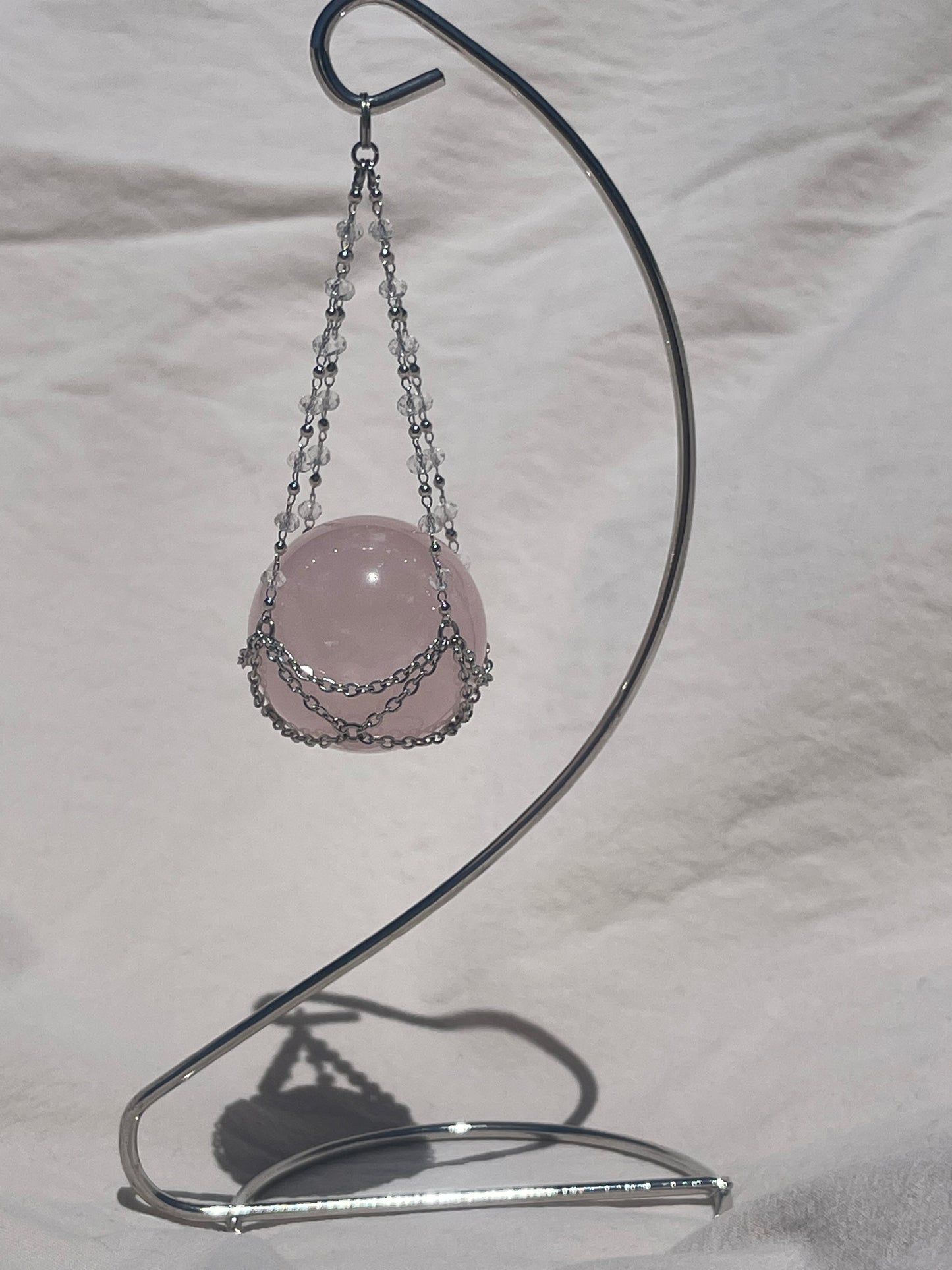 Rose Quartz Crystal Sphere On Luxury Metal Stand