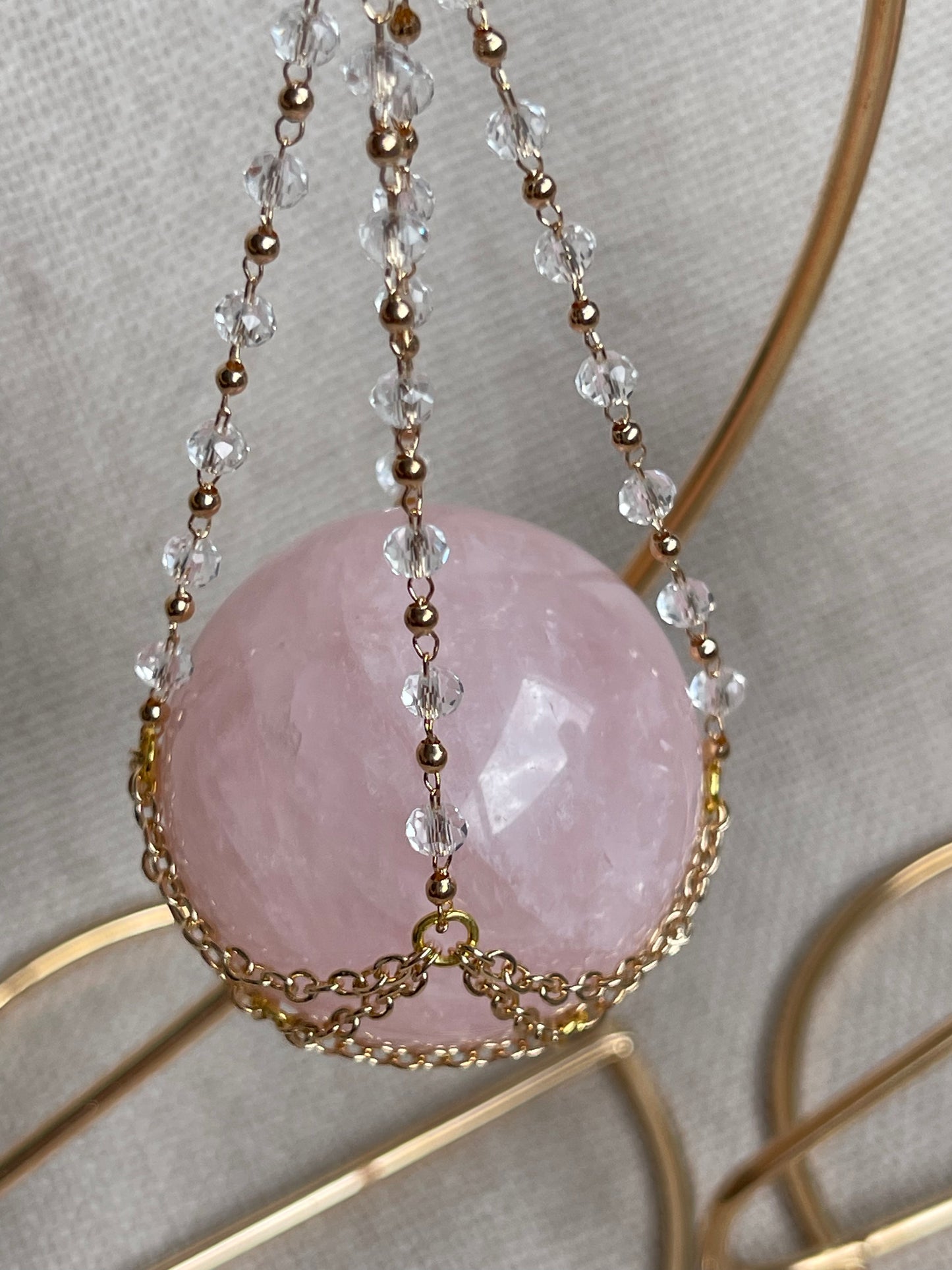 Rose Quartz Crystal Sphere On Luxury Metal Stand